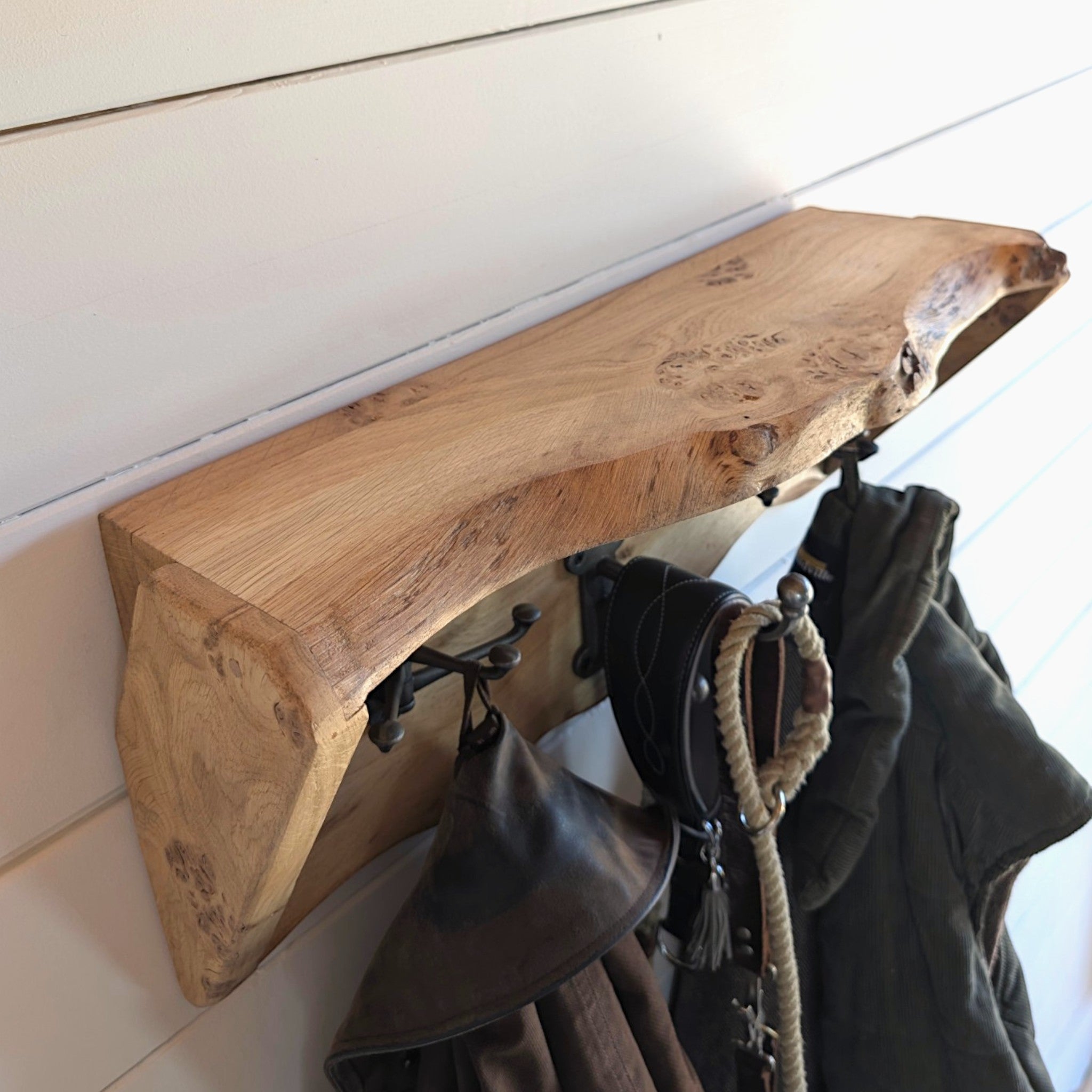 Thriverton live edge pippy oak coat rack and shelf featuring natural wood grain and rustic cast iron hooks