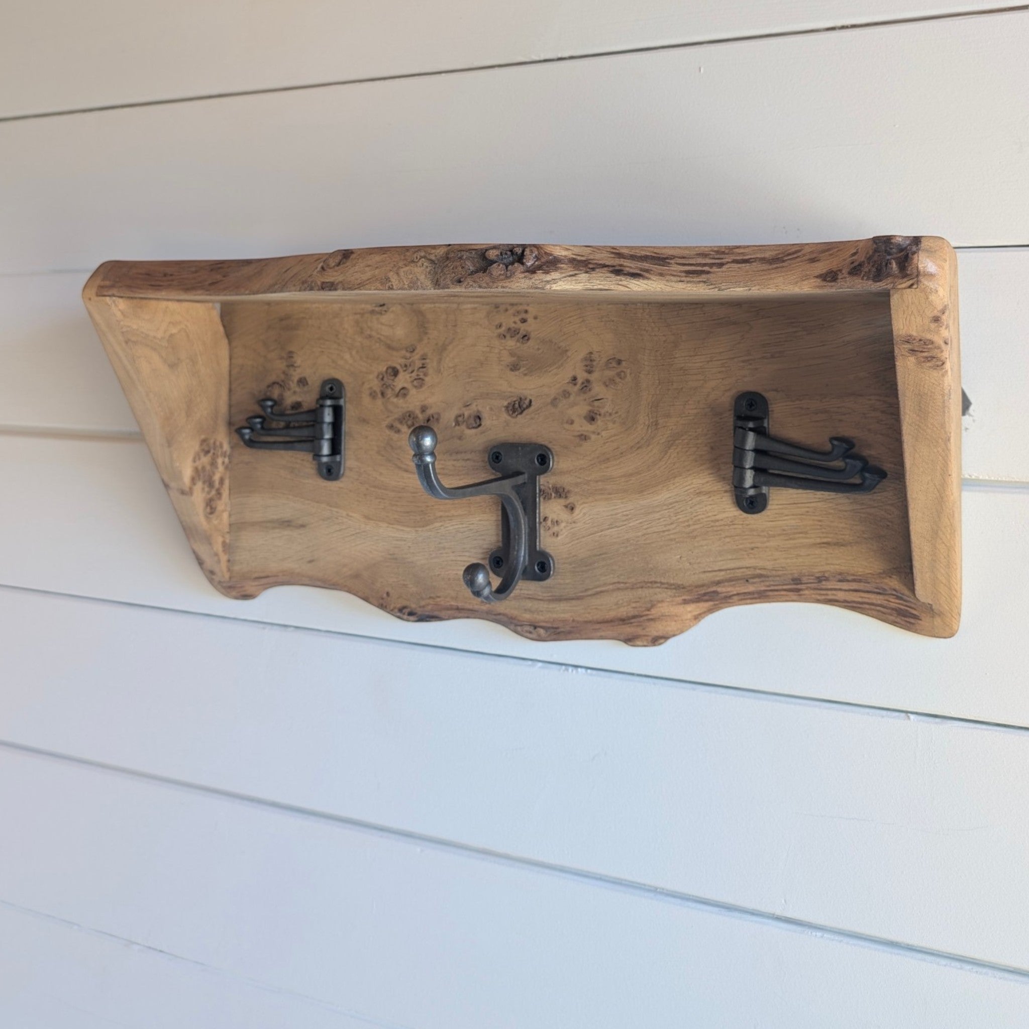 Thriverton live edge pippy oak coat rack and shelf with natural burr clusters and three black cast iron hooks