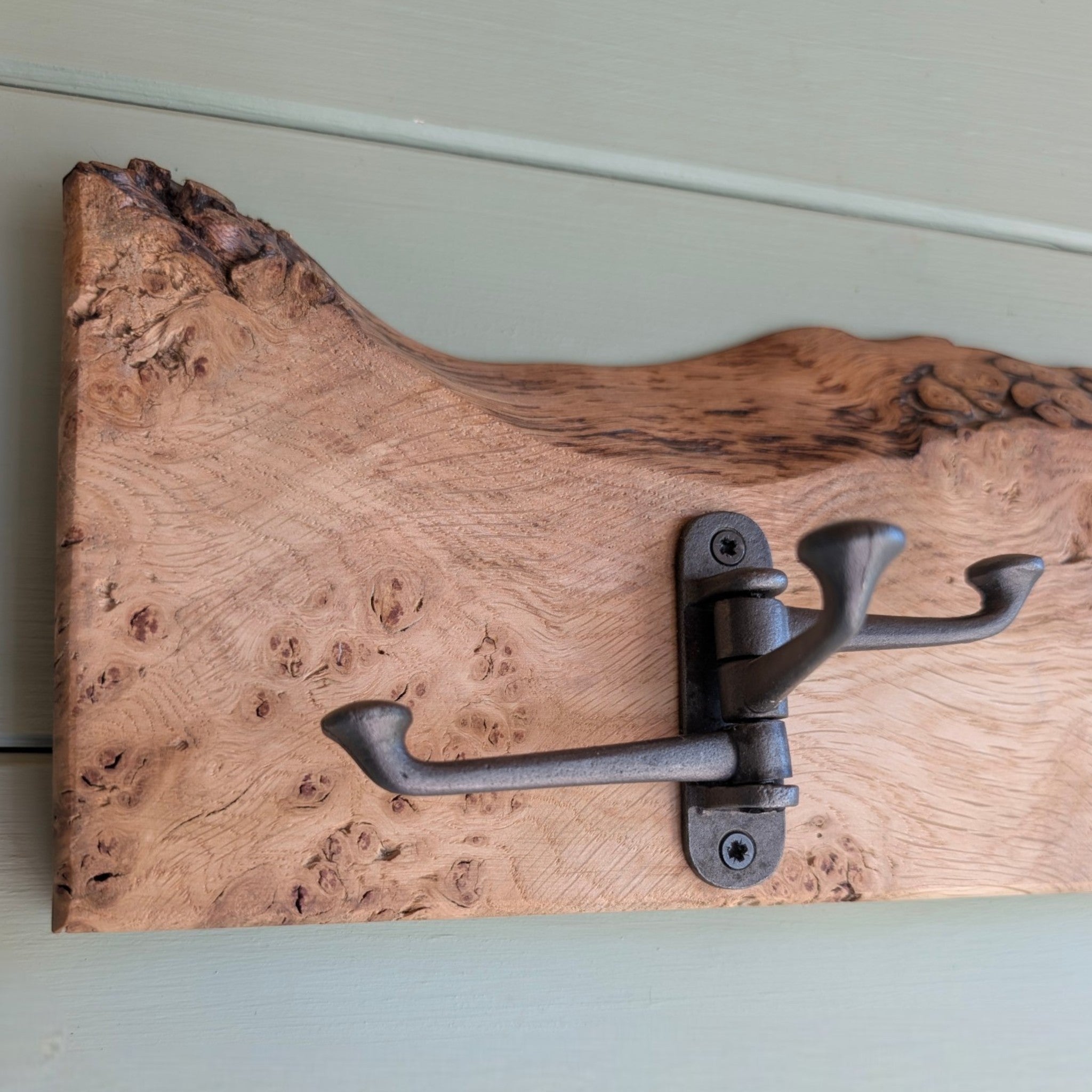 Thriverton hand-crafted live edge pippy oak coat rack featuring natural wood grain and a rustic cast-iron hook