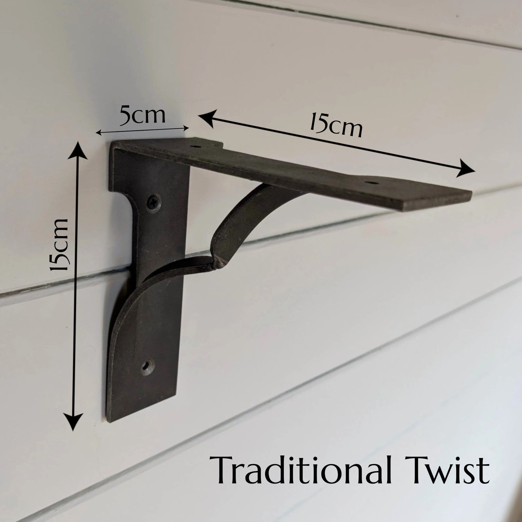 Thriverton Traditional Twist cast-iron shelf bracket mounted on a white wall with 15cm by 15cm dimensions shown.